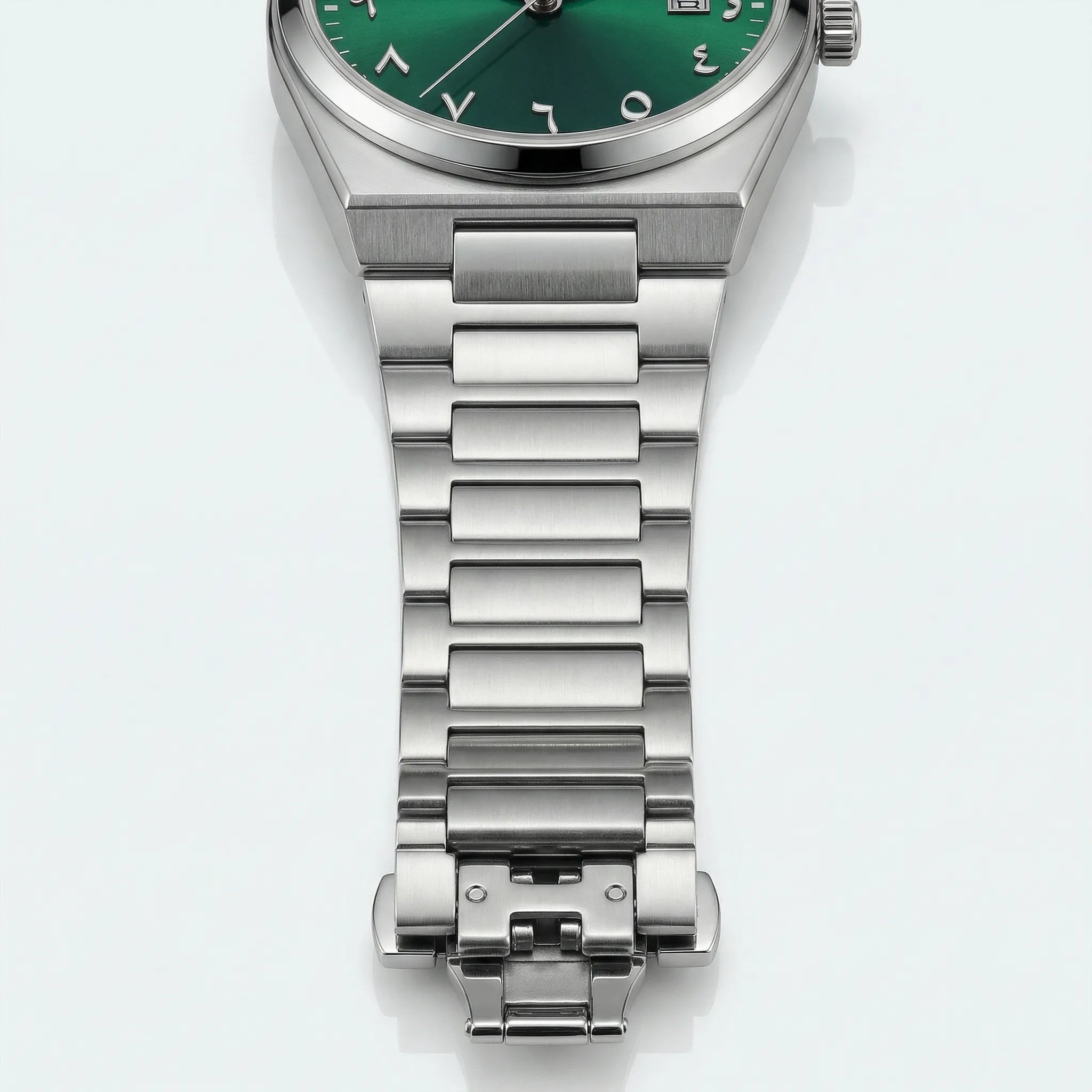 Classic straight-on view of a gold tone watch with a green Arabic dial, a timeless gold watch for men.