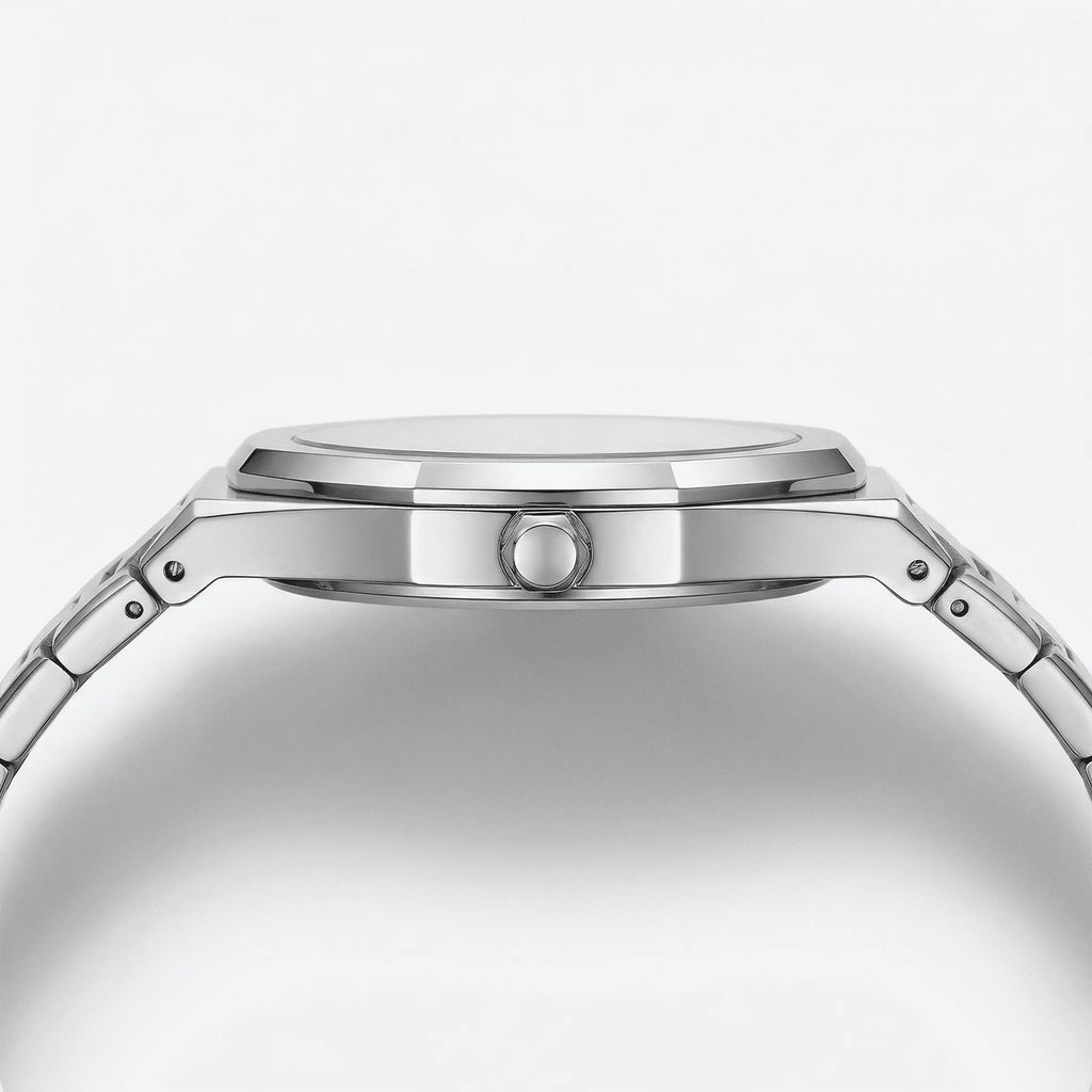 Close-up of the large Arabic dial on an ultra-thin silver dress watch, highlighting its refined layout.