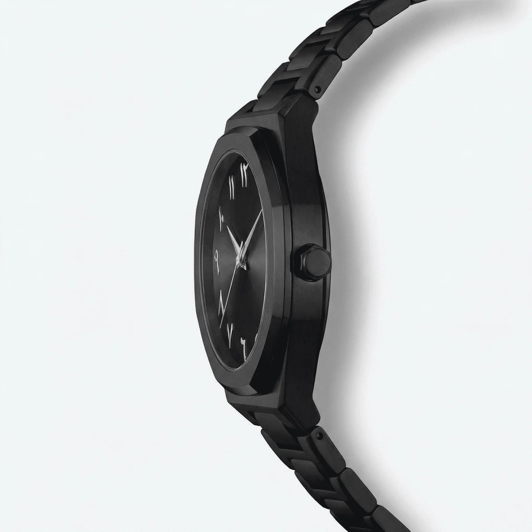 Close-up of the large black Arabic dial on an ultra-thin dress watch, a refined analog watch.