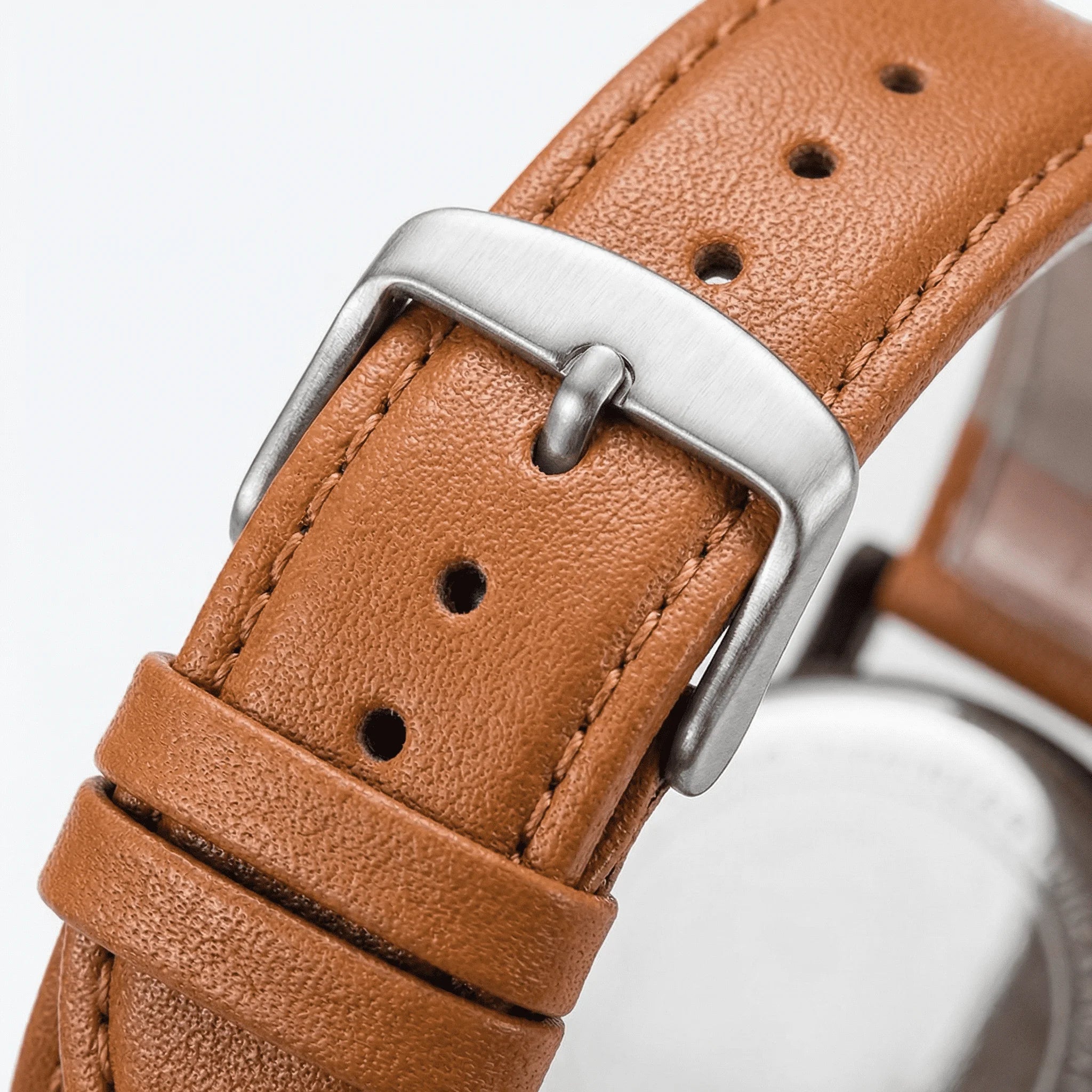 Classic straight-on view of an elegant white Arabic dial watch, a premium accessory.