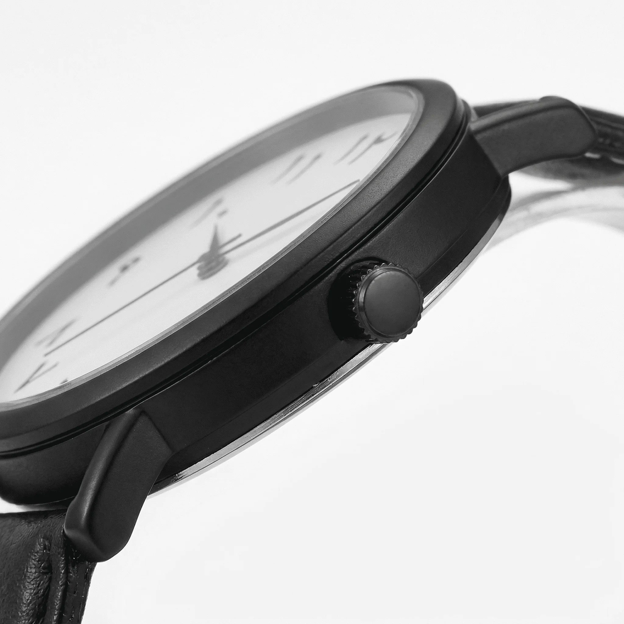 Close-up of the clean black Arabic dial on an elegant watch, highlighting its readable numerals.