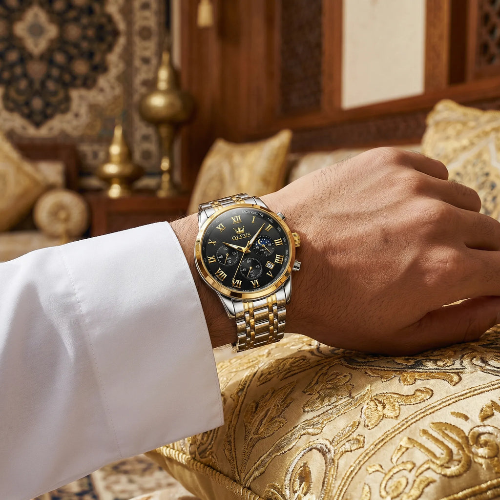 Man wearing a heavy duty gold tone watch on his wrist, showcasing an uncompromising powerful look.