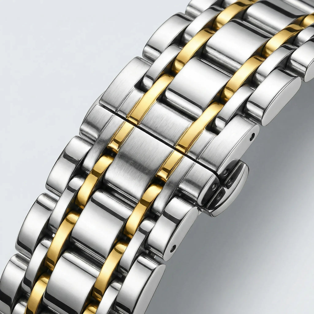 Close-up of the intricate black dial with Roman numerals on a heavy duty gold tone watch.