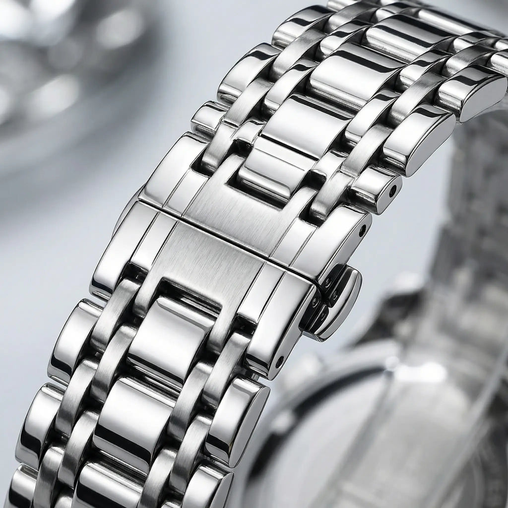 Detailed view of the thick silver stainless steel band and folding clasp on a heavy duty watch.