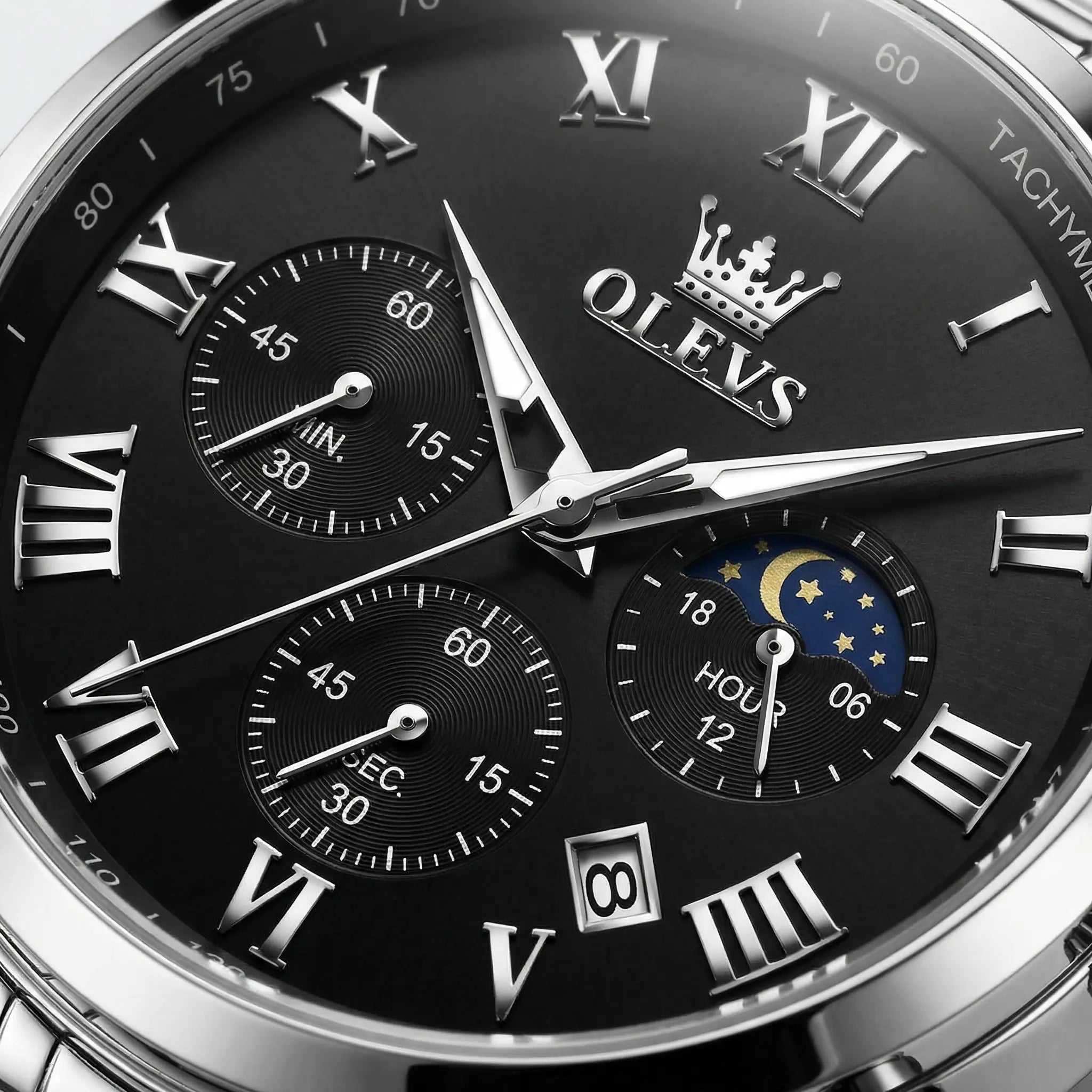 Close-up of the intricate black dial with Roman numerals on a heavy duty silver watch.