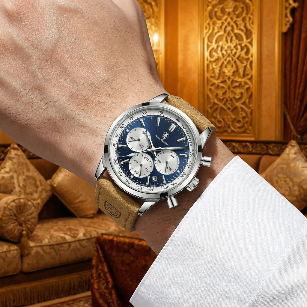 Man wearing a rugged silver and blue sport watch on his wrist, showcasing a dynamic active look.