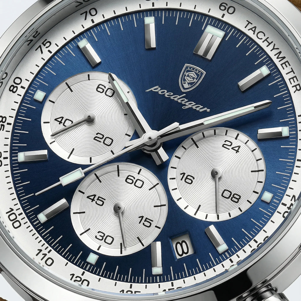 Close-up of the luminous blue dial on a sport watch, highlighting its chronograph functions.