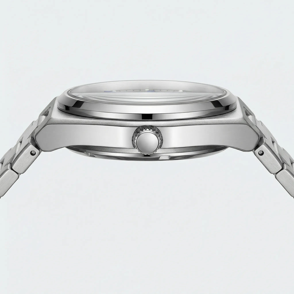 Close-up of the intricate mechanical style fascia and Arabic numerals on a unique silver watch.