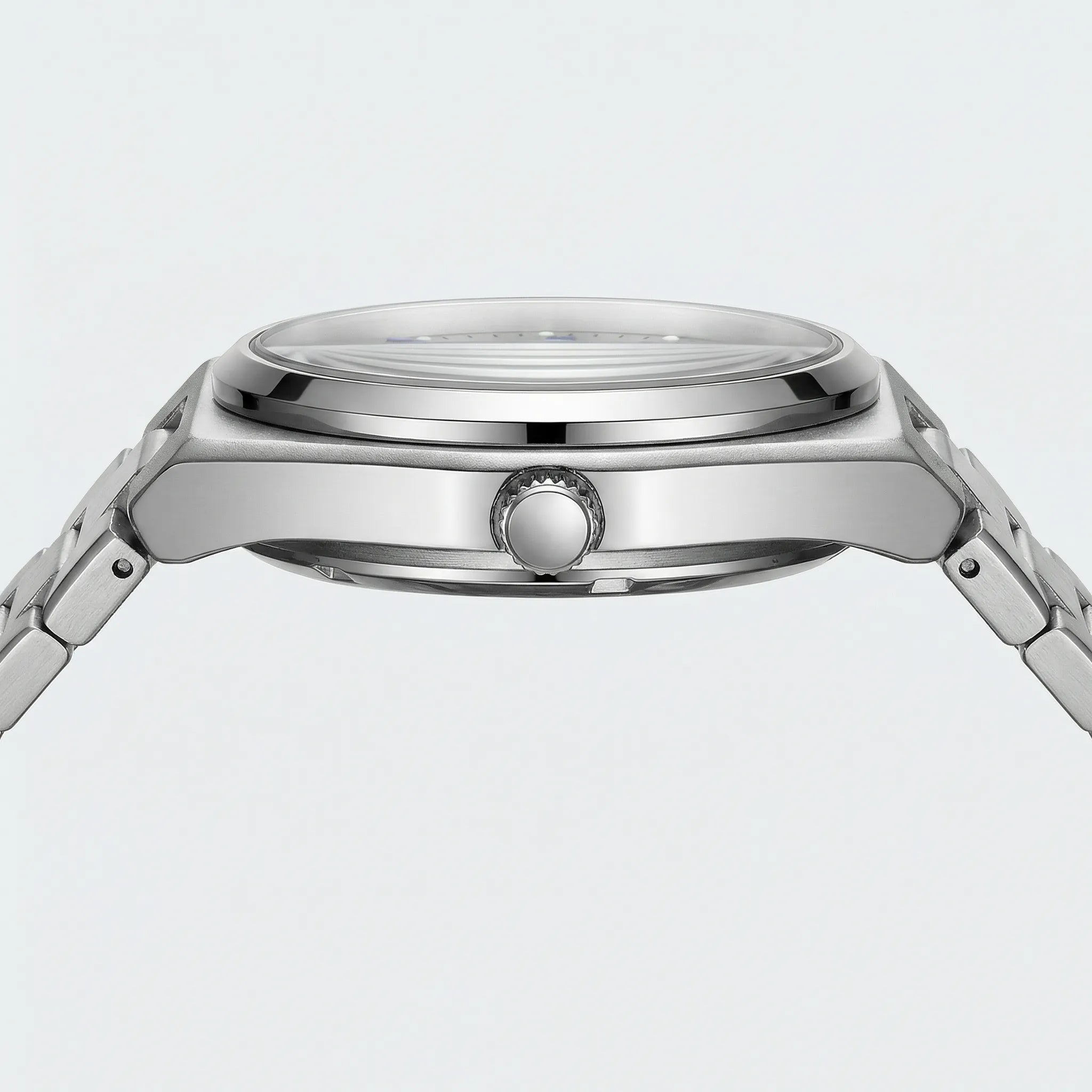 Close-up of the intricate mechanical style fascia and Arabic numerals on a unique silver watch.