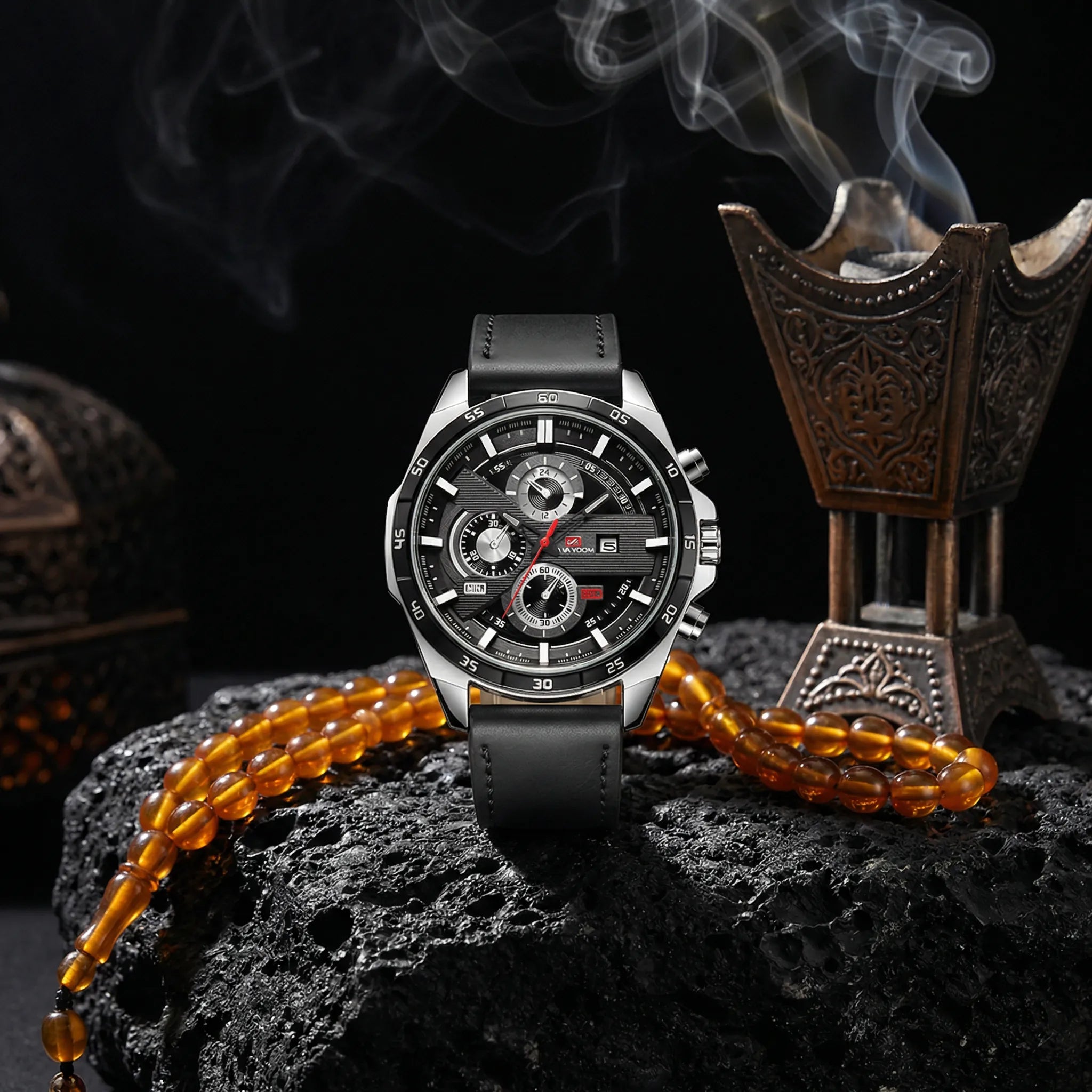 Man wearing a classic watch with a black leather strap on his wrist, an elegant everyday look.