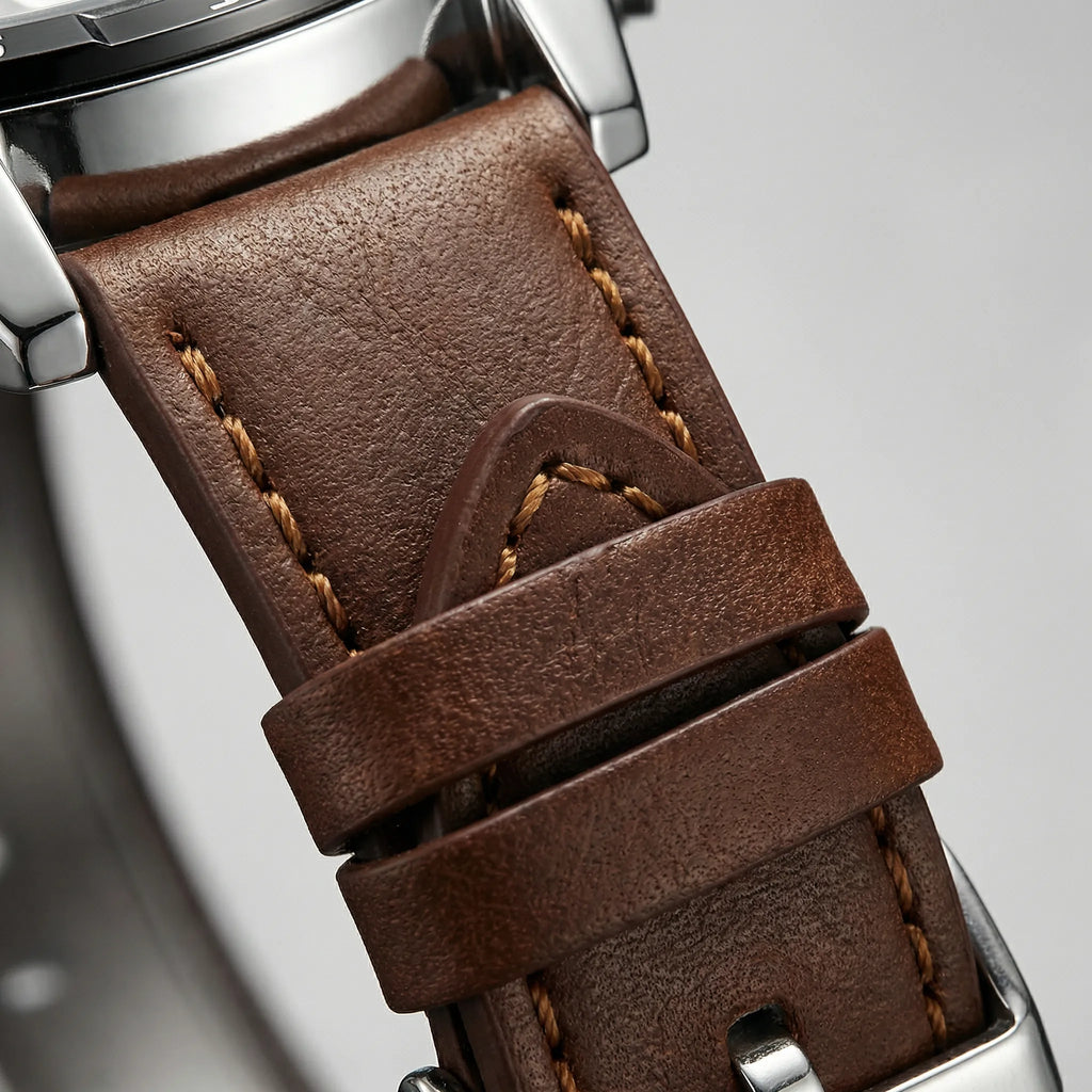 Side profile view highlighting the sturdy case of a casual watch with a brown leather band.