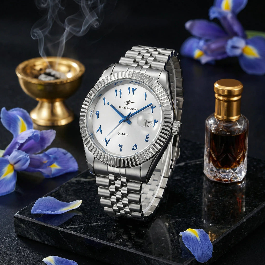 Man wearing a silver business watch with a white Arabic dial on his wrist, showcasing a professional look.