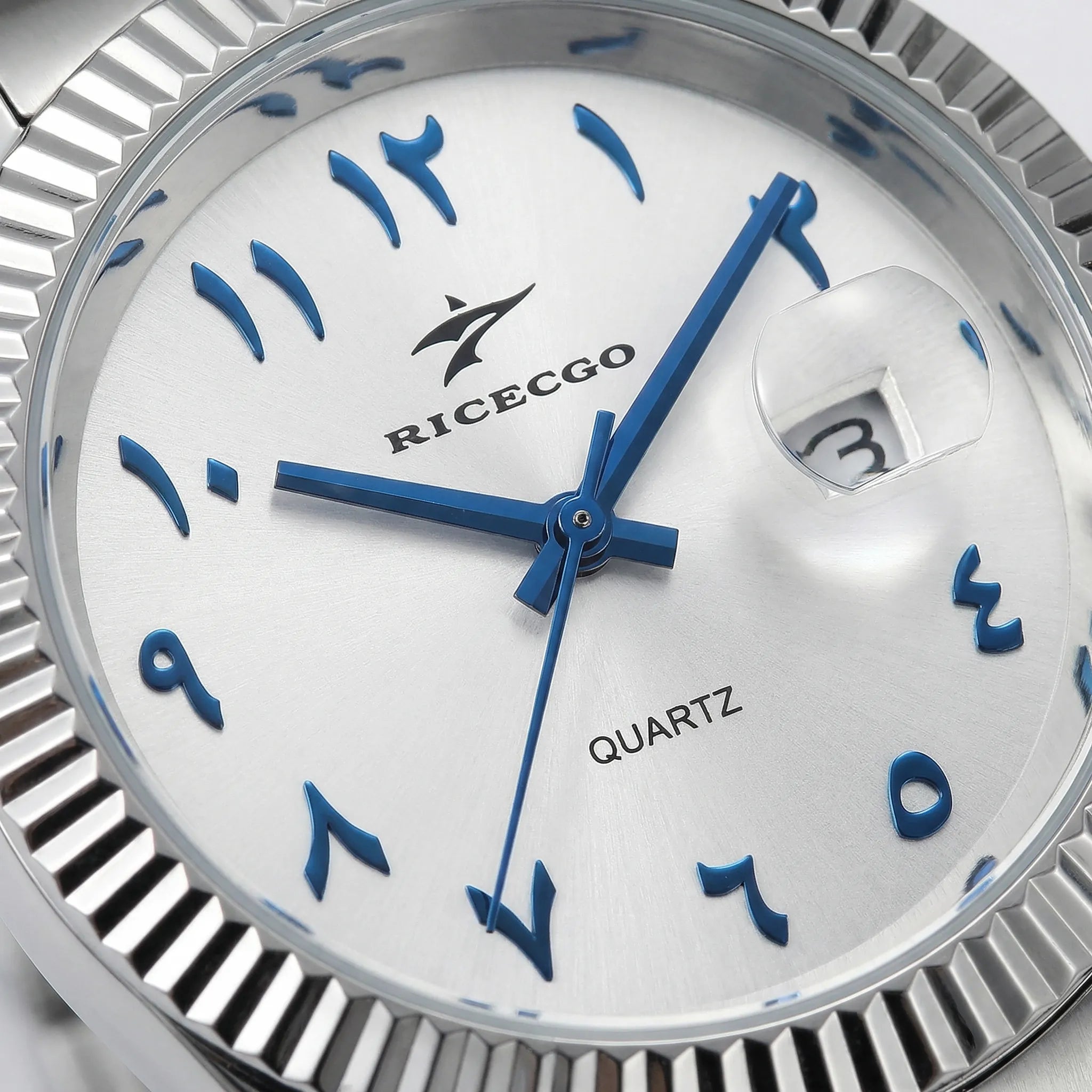 Close-up of the striking white Arabic dial on a silver business watch, highlighting its clear numerals.