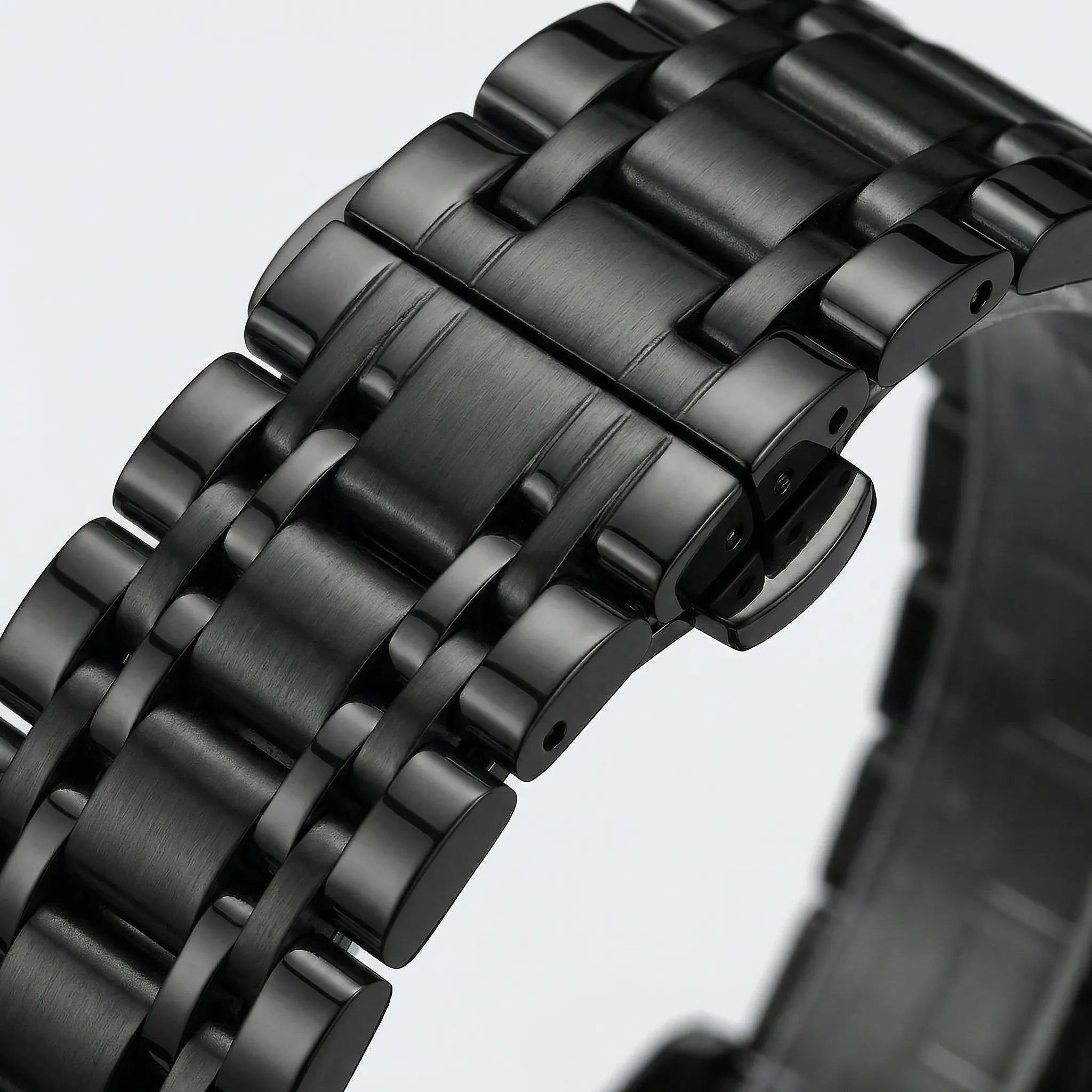 Side profile showing the sleek case of a watch with a black dial, a sophisticated black watch for men.