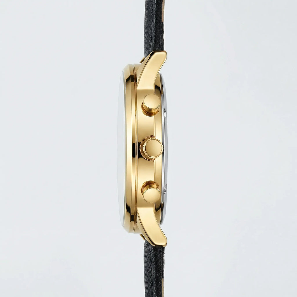 Angled presentation of a modern gold tone dress watch, a sleek choice among gold watches for men.