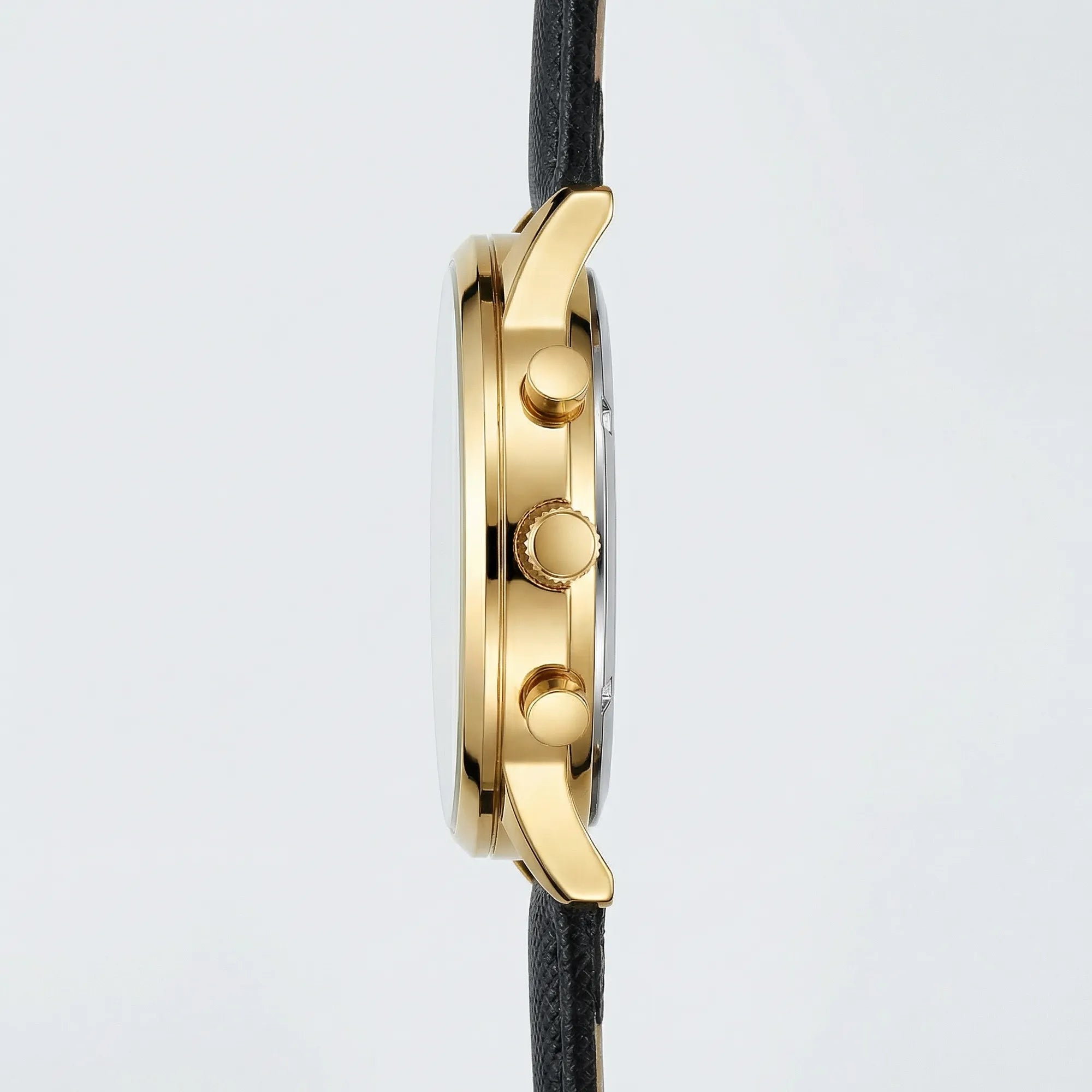 Angled presentation of a modern gold tone dress watch, a sleek choice among gold watches for men.