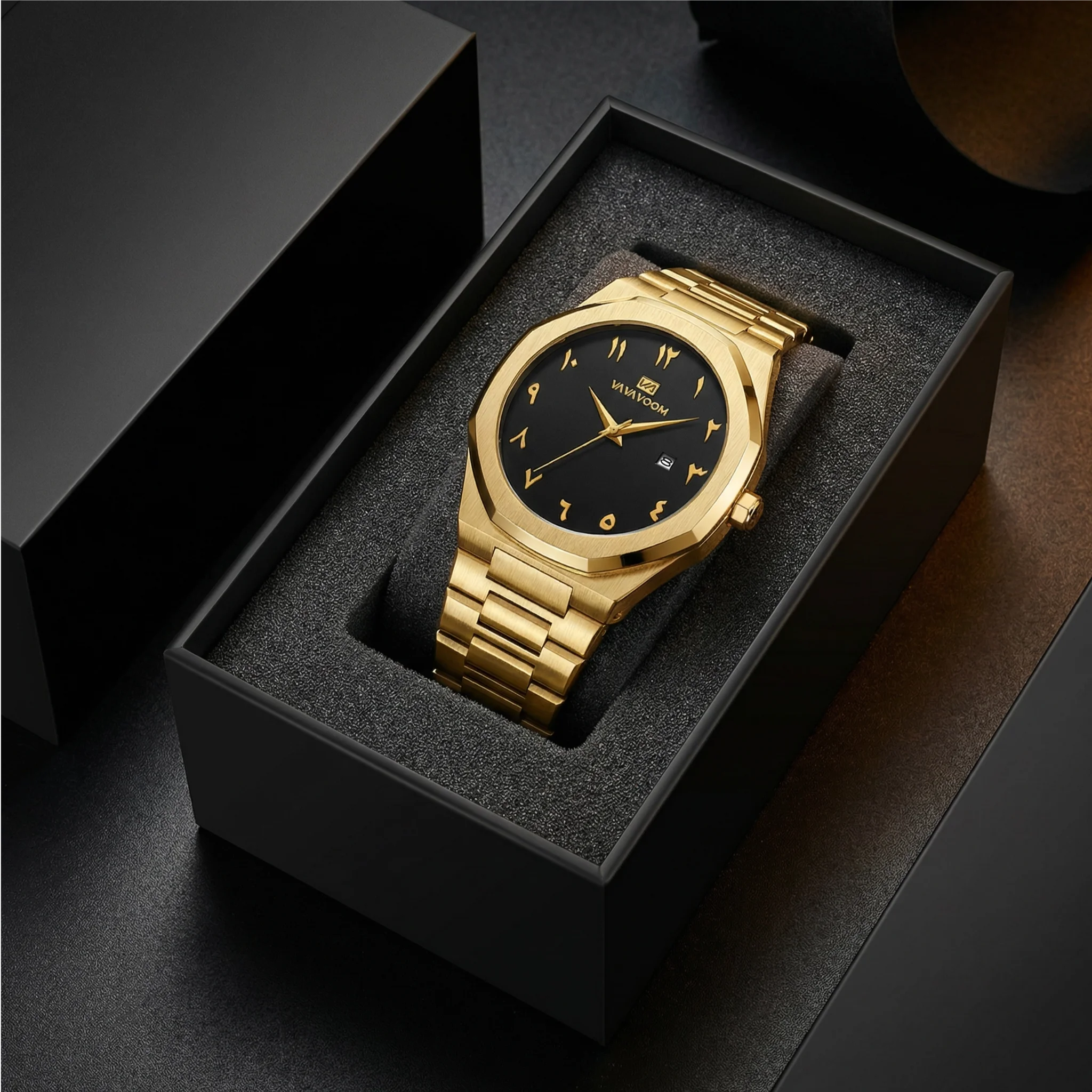 Detailed view of the integrated gold tone stainless steel band on a geometric luxury watch.