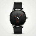 Detailed front view of a minimalist black and red watch with a mesh band, an elegant simple watch.