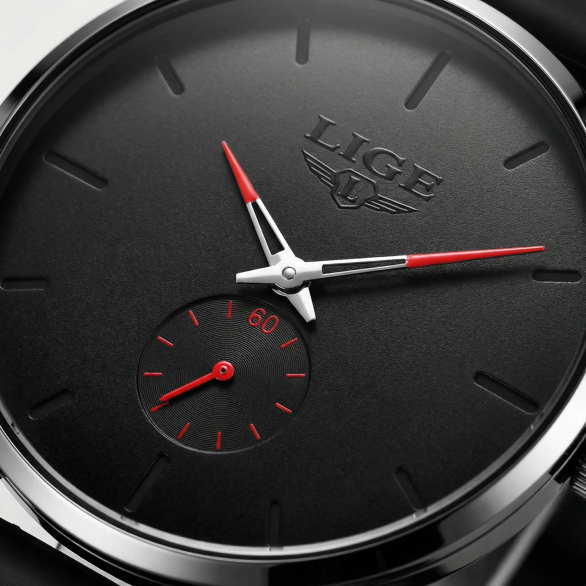Close-up of the clean numberless dial on a minimalist watch, highlighting its understated design.