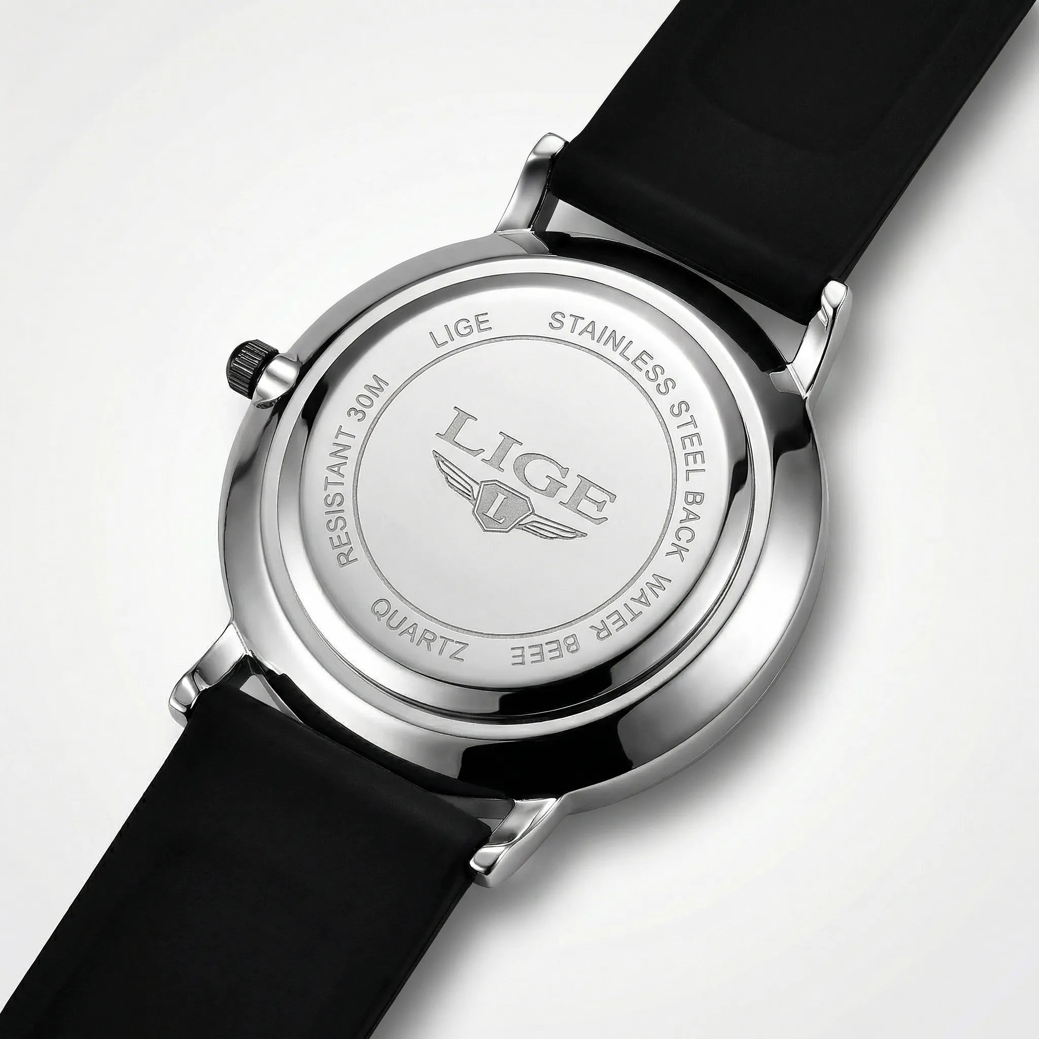 Side profile demonstrating the slim 8mm case of a black and red minimalist watch.