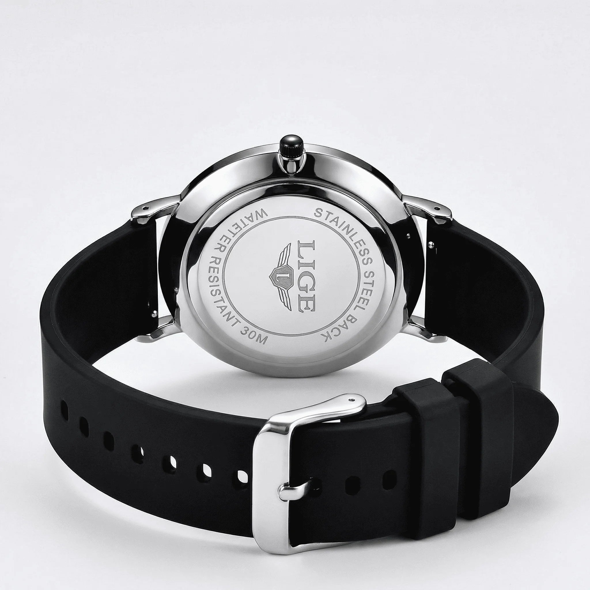 Close-up of the clean numberless dial on a minimalist watch, highlighting its understated design.