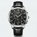 Detailed front view of a silver watch with a black dial and leather band, an elegant dress watch.
