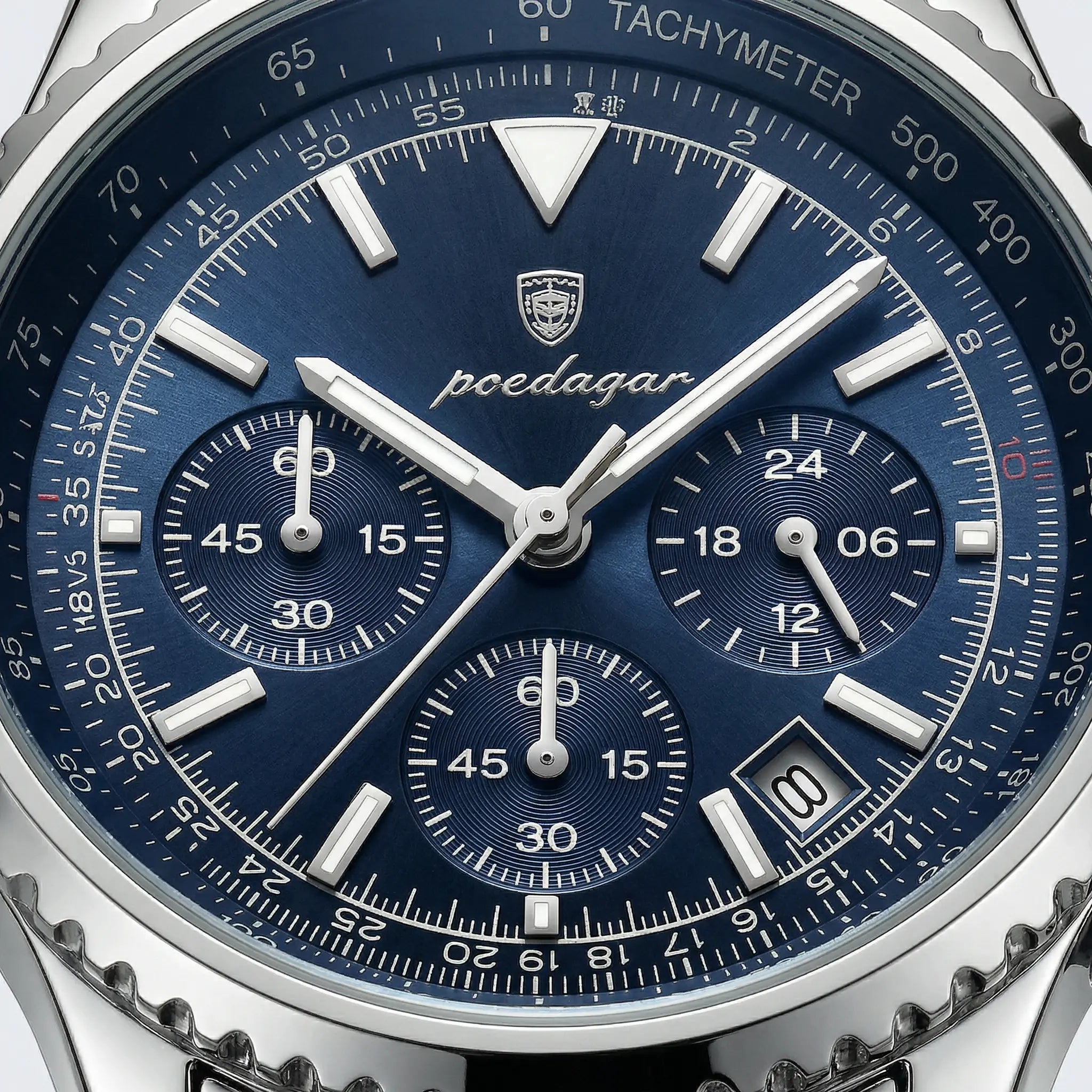Angled presentation of a silver watch with a blue dial, a luxury dress watch for men.