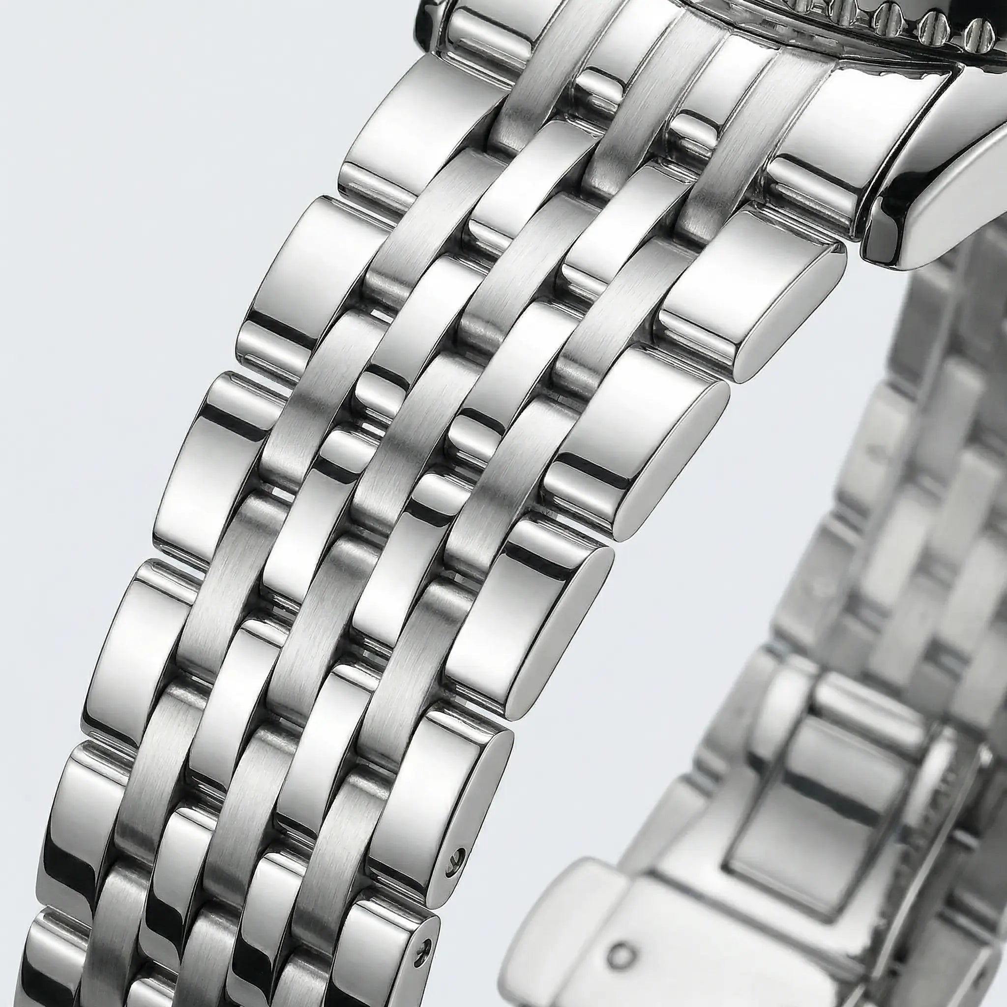 Classic straight-on view of a silver stainless steel watch, a highly sought-after blue dial watch.