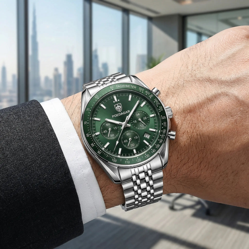 Man wearing a silver stainless steel watch with a green dial on his wrist, showcasing an elegant everyday look.