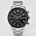 Detailed front view of a racing chronograph watch with a black dial and silver accents, a dynamic sports watch.