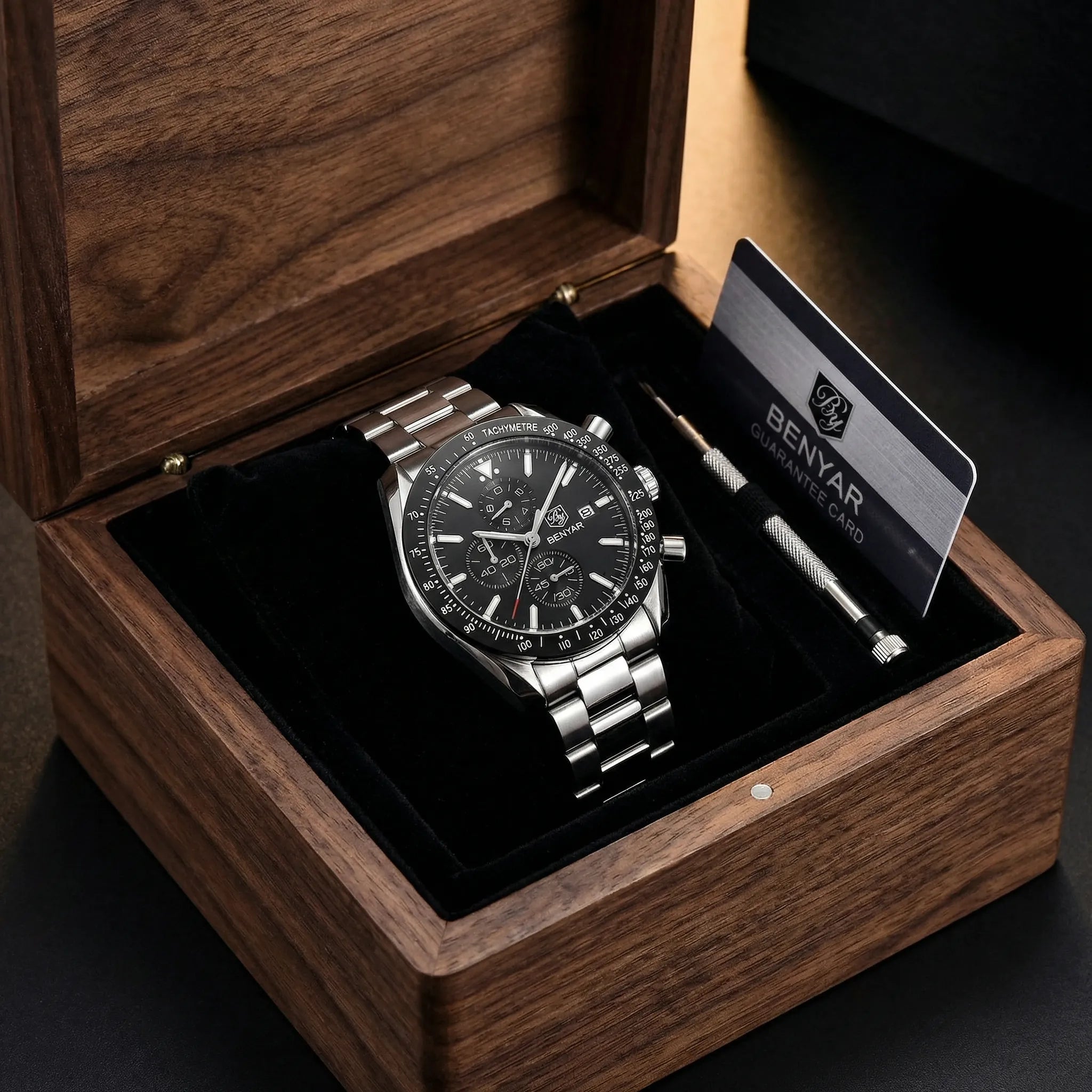 Man wearing a racing chronograph watch with a black dial on his wrist, showcasing a bold sporty look.