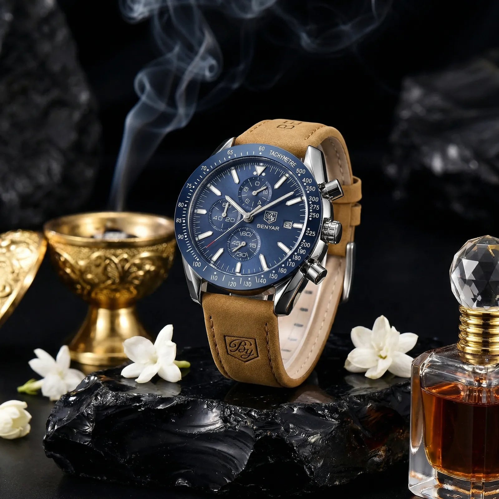 Man wearing a racing chronograph watch with a blue dial on his wrist, showcasing speed and style.