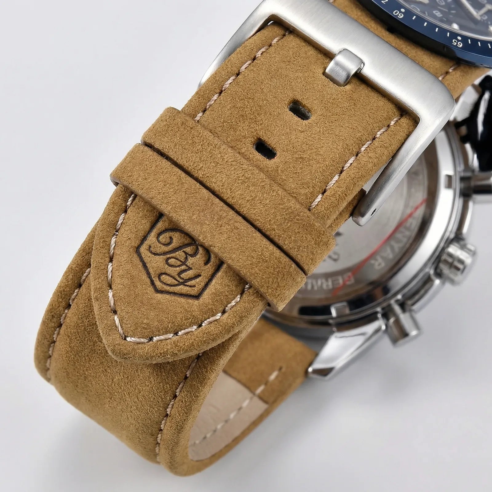 Side profile showing the unique Tonneau case of a racing sports watch, a bold analog watch.