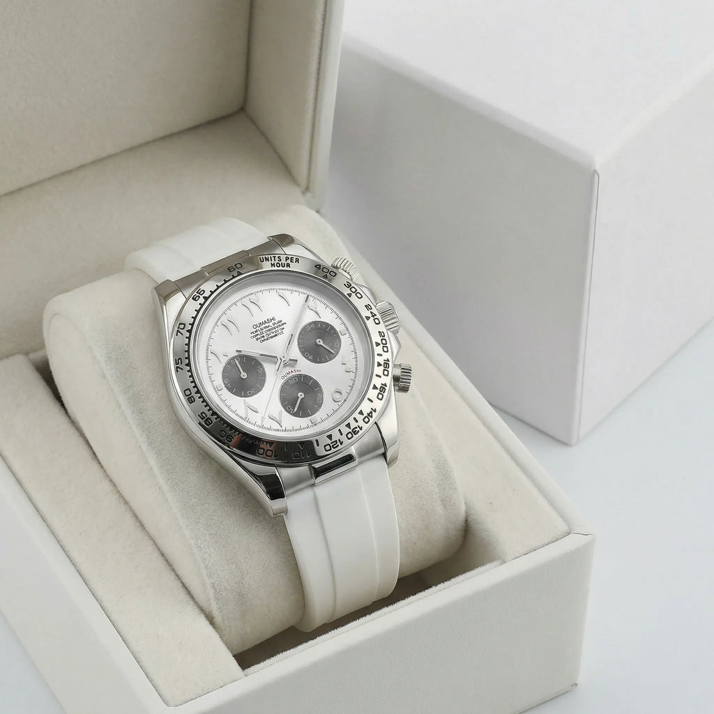 Close-up of the precision hands and Arabic numerals on a white dial silver watch.