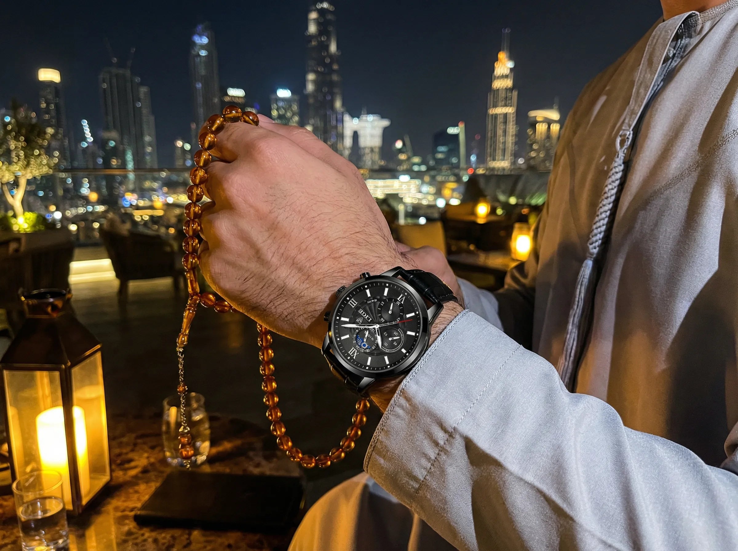 Man wearing a classic casual watch with a black leather band on his wrist, a stylish everyday accessory.